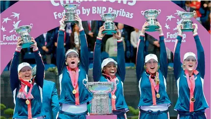  ?? — AFP ?? US team celebrate with their trophies after winning the Fed Cup final against Belarus in Minsk on Sunday.