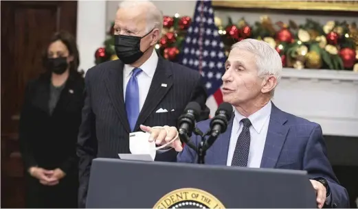  ?? OLIVER CONTRERAS/POOL/ABACAPRESS.COM/TNS ?? Dr. Anthony Fauci, chief medical adviser to the president, is joined by President Joe Biden and Vice President Kamala Harris on Monday as he talks about the Omicron variant in the Roosevelt Room of the White House.