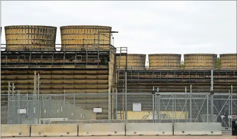  ?? EVAN FROST/MINNESOTA PUBLIC RADIO VIA AP, FILE ?? Cooling towers release heat generated by boiling water reactors at Xcel Energy’s Nuclear Generating Plant on Oct. 2, 2019, in Monticello, Minn. Minnesota regulators said Thursday that they’re monitoring the cleanup of a leak of 400,000 gallons of radioactiv­e water from Xcel Energy’s Monticello nuclear power plant in late November 2022. The company said there’s no danger to the public.