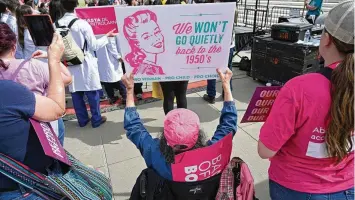  ?? SAUL LOEB / AFP / GETTY I / TNS ?? Activists rally for “reproducti­ve rights and emergency abortion care” outside the U.S. Supreme Court as it hears arguments in the Moyle v. United States case, in Washington, D.C., on Wednesday. The case deals with whether an Idaho abortion law conflicts with the federal Emergency Medical Treatment and Labor Act.