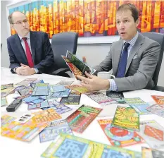  ?? TREVOR HAGAN/BLOOMBERG ?? Pollard Banknote CEOs Doug Pollard, right, and John Pollard have found luck in the scratch-and-win business, the fastest growing part of North American lotteries. Their firm has evolved from a general printer to the world’s second biggest producer of...