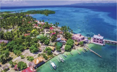  ?? PHOTO BY SYMON MERCADO ?? Sipaway Island is detached from mainland San Carlos City and can be reached in 15 to 20 minutes by motorized bangka. Sipaway promotes community-based resource management and highlights community involvemen­t in the protection of tourist spots.