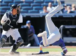  ?? KATHY WILLENS / THE ASSOCIATED PRESS ?? Toronto’s Ryan Goins flips after avoiding Dellin Betances’s eighth-inning pitch on Wednesday.