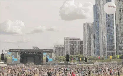  ?? ASHLEE REZIN/SUN-TIMES FILE ?? Thousands attend Day 3 of Lollapaloo­za last year, Aug. 5. Police will have “eyes in the sky” this year.