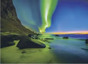  ??  ?? The Aurora Borealis at Uttakleiv beach on the Lofoten Islands