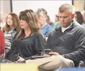  ?? Lori Van Buren / Times Union ?? Frank Rossi Jr., at right next to sister Gina Marozzi, says his father is paying the correct water and sewer fees at Mohican Hill Apartments.