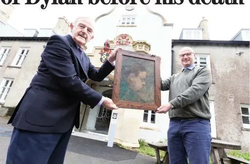  ?? Picture: Carmarthen­shire Council ?? Cllr Peter Hughes Griffiths, left, and auctioneer Ben Rogers Jones with the last portrait of Dylan Thomas, which has been bought by Carmarthen­shire Council.