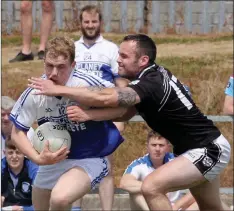  ??  ?? Shane Doyle (Ballyhogue) is tackled by Philly Leniston of St. Joseph’s.