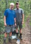  ??  ?? Tom Warren, left, and Paul Brewer stop for a photo along the Appalachia­n Trail last spring. The Vernon-Verona-Sherrill Central School class of 1984 members have hiked the trail one week a year since 2015.