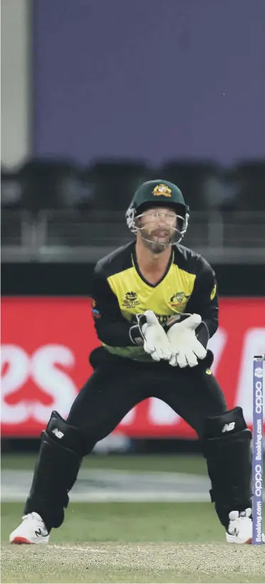  ?? ?? Australia wicketkeep­er can only watch as England’s Jos Buttler plays another shot as he steers England to victory