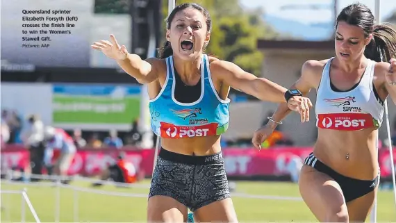  ?? Pictures: AAP ?? Queensland sprinter Elizabeth Forsyth (left) crosses the finish line to win the Women's Stawell Gift.