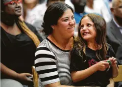 ??  ?? Michelle Mills and her daughter, Grace, 7, were part of the audience as the Bileses recorded a podcast Wednesday with host Andrew Hawkins.