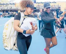  ?? KELLY BARNES/AP ?? Naomi Osaka, left, of Japan, and Serena Williams, of the U.S., walk from the court together following an exhibition tennis event Friday in Adelaide, Australia.