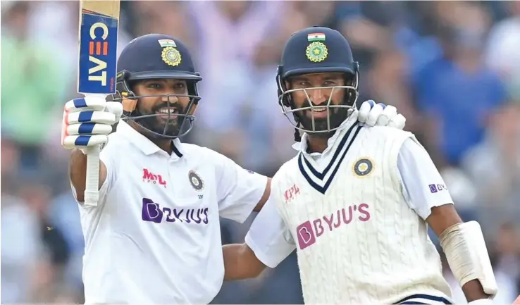  ?? Photo: AP ?? India’s Rohit Sharma celebrates scoring a century with teammate Cheteshwar Pujara during the fourth Test against England.