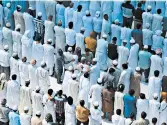  ?? GETTY-AFP ?? Muslims gather at Kaaba in Saudi Arabia’s holy city of Mecca on Friday as friends and relatives of Jamaal Khashoggi take part in the absentee funeral prayer.