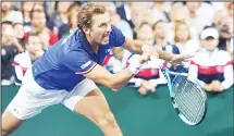  ??  ?? France’s Julien Benneteau plays a forehand return with teammate Nicolas Mahut in their doubles rubber against Spain’s Marcel Granollers and Feliciano Lopez for the Davis Cup semifinal tennis match between France andSpain at Villeneuve-d’Ascq, northern France, on Sept 15. (AFP)