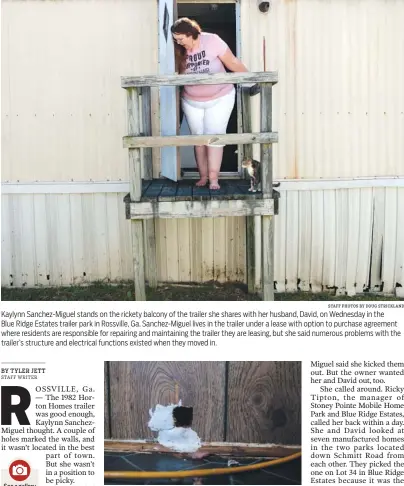  ?? STAFF PHOTOS BY DOUG STRICKLAND ?? Kaylynn Sanchez-Miguel stands on the rickety balcony of the trailer she shares with her husband, David, on Wednesday in the Blue Ridge Estates trailer park in Rossville, Ga. Sanchez-Miguel lives in the trailer under a lease with option to purchase...