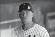  ?? CHARLIE NEIBERGALL/AP PHOTO ?? New York Yankees center fielder Aaron Judge walks in the dugout before a spring training game against the Atlanta Braves on March 10 in Tampa, Fla.