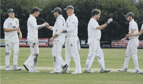  ?? PHOTOS BY RICHARD PONTER ?? Folkton & Flixton 2nds fielders celebrate a wicket in their crucial win on the road against Seamer & Irton