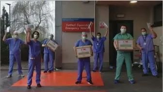  ??  ?? Staff from Cork University Hospital taking delivery of PPE donated by UCC alumni living and working In China.