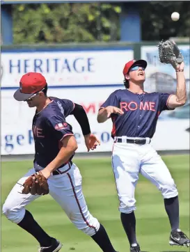  ??  ?? ABOVE: Rome shortstop Jordan Rodgers (left) turns away as left fielder Bradley Keller makes a catch for an out during the fifth inning Monday’s game against Columbia at State Mutual Stadium.