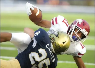  ?? NWA Democrat-Gazette/CHARLIE KAIJO ?? Shiloh Christian High School Keaton Carter Christian High School in Springdale. (25) tackles Arkansas High School wide receiver Naijah Taylor (11) on Friday at Shiloh