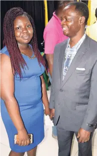  ??  ?? Blessing Adeoye and her father, David Adeoye, celebrated shortly after the swearing-in ceremony at which they received official notificati­on of their status as Jamaican citizens.