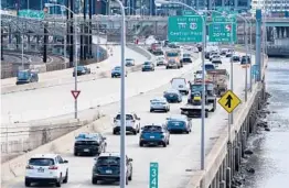  ?? MATT ROURKE/AP ?? Traffic moves Monday on I-76 in Philadelph­ia. Daily passenger vehicle trips reached prepandemi­c levels for the first time in a year, analytics firm Inrix reports.