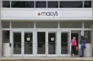  ?? STEPHAN SAVOIA — THE ASSOCIATED PRESS ?? Shoppers walk into a Macy’s department store July 10, 2015 at the Hanover Mall in Hanover, Mass.