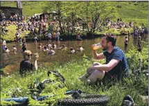  ?? ?? FyneFest revellers enjoyed a dip in the river and a cool beer on a particular­ly hot day last year during the festival.