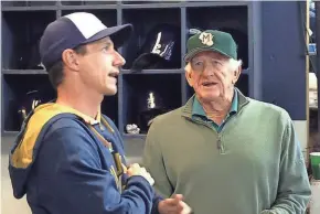  ?? JOURNAL SENTINEL ?? Brewers manager Craig Counsell and Bob Uecker visit in the dugout at Miller Park (now American Family Field).