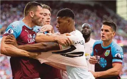  ?? EPA PIC ?? Burnley’s Phil Bardsley (left) clashes with Manchester United’s Marcus Rashford on Sunday.