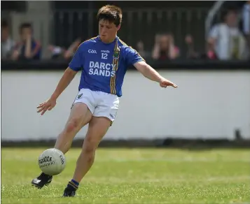  ??  ?? Wicklow’s John Keogh shows nerves of steel to kick over the equalising point from a free.