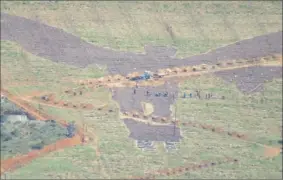  ??  ?? BLESSED: Louise Smith captured this picture of workers making an image of an angel on a field in Stellenbos­ch.