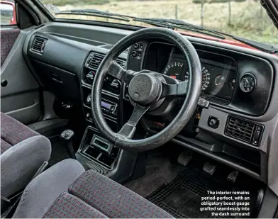  ??  ?? The interior remains period-perfect, with an obligatory boost gauge grafted seamlessly into the dash surround