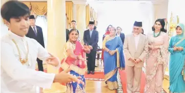  ??  ?? Taib and Raghad being welcomed on arrival at the function.