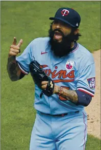  ?? BRUCE KLUCKHOHN — THE ASSOCIATED PRESS ?? Minnesota Twins reliever Sergio Romo celebrates after striking out a batter to close out a victory in Minneapoli­s last season.