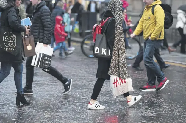  ?? PICTURE: JOHN DEVLIN ?? Shoppers on the streets of Glasgow amid the SRC warning over the ‘low ebb’ of retail sales in recent years