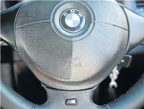  ??  ?? LEATHER LOOK: The steering wheel with its M badge