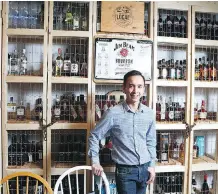  ?? PHOTOS: JIM WELLS ?? James Nguyen of Belle Southern Kitchen and Bar in the Mission district shows off the whisky wall.