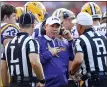  ?? ASSOCIATED PRESS FILE PHOTO ?? THEN-LSU head coach Les Miles talks with referees during the first half of a 2016game against Auburn in Auburn, Ala.