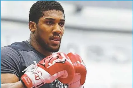  ??  ?? World heavyweigh­t boxing champion Anthony Joshua has gone into self isolation as precaution­ary measure since learning of