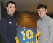  ??  ?? Darragh McCoy (Dundalk Grammar) is congratula­ted by Ray McCabe.