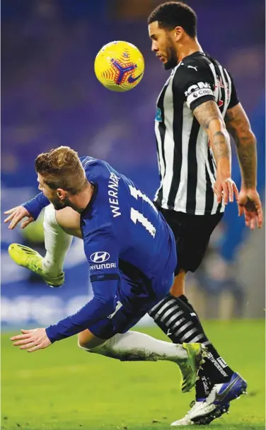  ?? Agence France-presse ?? Chelsea’s Timo Werner vies for the ball with Newcastle United’s Jamaal Lascelles during their English Premier League match on Monday.