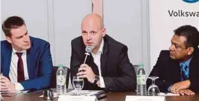  ?? PIC BY
EIZAIRI SHAMSUDIN ?? Volkswagen (VW) Passenger Cars Malaysia Sdn Bhd managing director Erik Winter (centre) with managing director of aftersales, informatio­n technology and finance Florian Steiner (left) and aftersales director Deenan Nadar at the briefing yesterday.