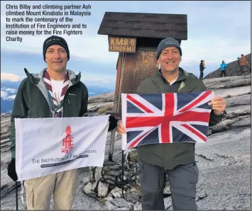  ??  ?? Chris Bilby and climbing partner Ash climbed Mount Kinabalu in Malaysia to mark the centenary of the Institutio­n of Fire Engineers and to raise money for the Fire Fighters Charity