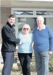  ??  ?? New windows Jason Lisett of Caledonian Windows with Iain and Morven Miller of Prestwick