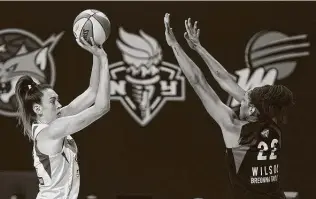  ?? Chris O’Meara / Associated Press ?? Seattle forward Breanna Stewart, left, shoots against Las Vegas center A’ja Wilson during the second half of Game 1 of basketball’s WNBA Finals on Friday.