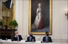  ?? Doug Mills/The New York Times ?? From left, Apple CEO Tim Cook, IBM CEO Arvind Krishna and Alphabet CEO Sundar Pichai listen to President Joe Biden during a meeting about cybersecur­ity Wednesday at the White House.