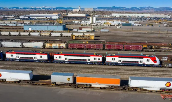  ?? Chip Sherman ?? Stadler-built Caltrain commuter cars are seen on the Union Pacific Moffat Tunnel Subdivisio­n in Denver in February 2021. The cars were en route from the plant in Utah to the Transporta­tion Technology Center Inc. test track near Pueblo.